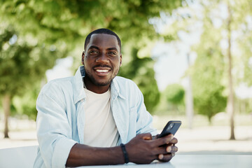Man smile mobile cellphone smartphone phone lifestyle person black male happy looking young - obrazy, fototapety, plakaty