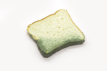 Piece of wasted bread isolated on white background. Top view, selected focus.