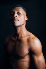 Studio portrait of nude young man posing