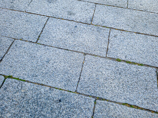 Background. Stone slabs on the pavement