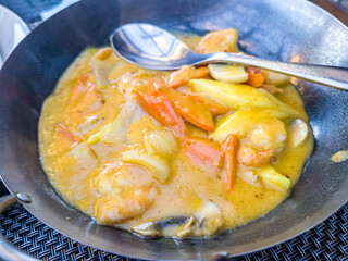 stewed vegetables with meat in white sauce are on a plate