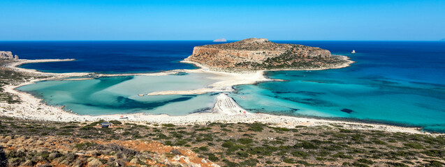 Blue lagoon in Balos, Crete, Greece. Beautiful lagoon at Mediterranean Sea. Balos Bay capture on the top of the mountain. View from above on a Gramvousa Island. Banner. - obrazy, fototapety, plakaty