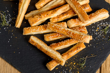 Sticks with sesame and cumin. Homemade cheese sticks. Home baking appetizers