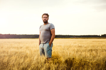 Man standing in grain field