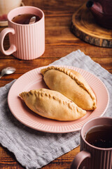 Two Cabbage Hand Pies on Plate