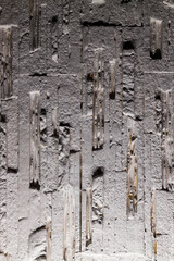 Vertical detailed brick wall texture. White brick texture, sharply illuminated from below, decorative light, strong shadows