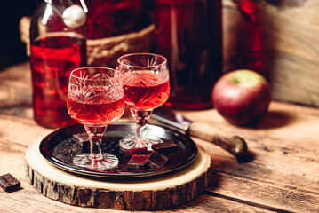 Homemade berry alcoholic beverage and chocolate