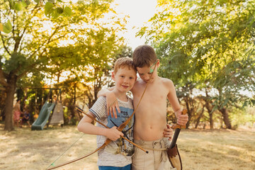 Boys playing with bow and arrows