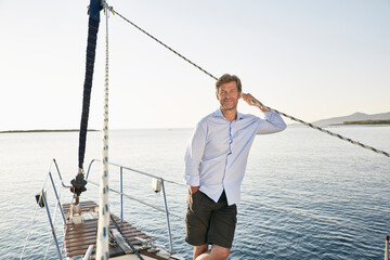 Portrait of realxed mature man on his sailing boat