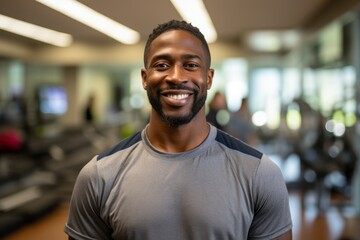 Fototapeta premium Confident Fitness Trainer Smiling at Gym 