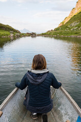 Austria, Tyrol, Fieberbrunn, Wildseeloder, woman in a boat on lake Wildsee