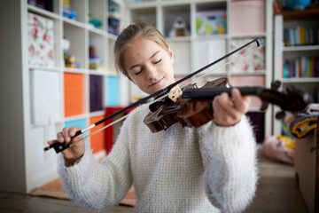 Girl exercising on her violin