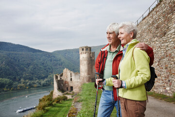 Germany, Rheingau, happy senior couple looking at view