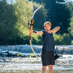 Portrait of archeress aiming with her bow