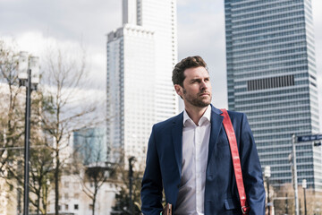 Successful businessman walking in the city