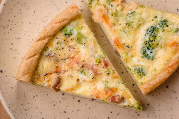 Delicious quiche with broccoli, cheese, chicken, spices and herbs