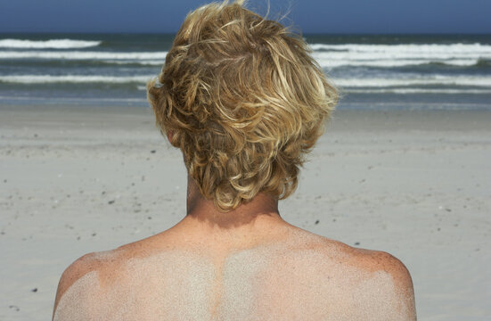 Young Man On The Beach
