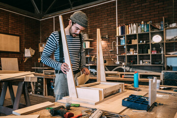 Carpenter working on wooden table