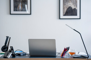 Office with desk and laptop at home