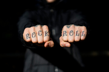 Man showing his tattooed hands, close-up