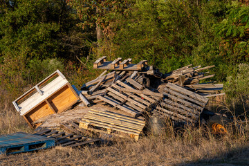 A pile of wooden pallets waiting to be recycle