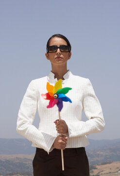 Business Woman holding Pinwheel
