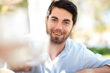 Portrait of smiling young man outdoors