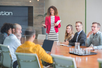 Businesswoman leading a meeting in boardroom