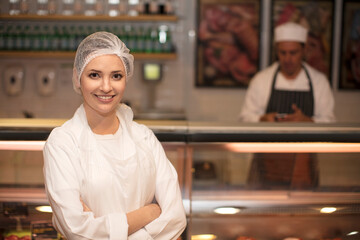 Portrait of smiling woman in butchery