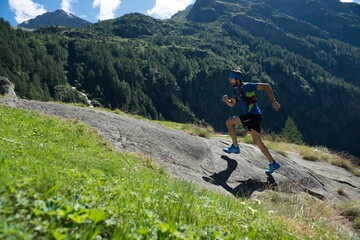 Italy, Alagna, trail runner on the move near Monte Rosa mountain massif