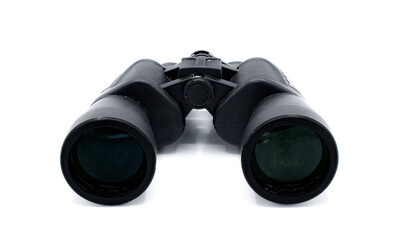 A pair of black rubber grip metal binoculars isolated on white background.  Well worn, used, dirty full of sand from being out in the field viewing wildlife.  Back view