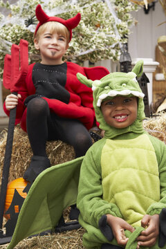 Portrait of Boy Dressed-up as Dragon with Boy Dressed-up as Devil