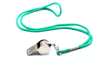 Whistle with green lace. White background. - obrazy, fototapety, plakaty
