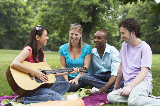 Friends Sitting Outdoors