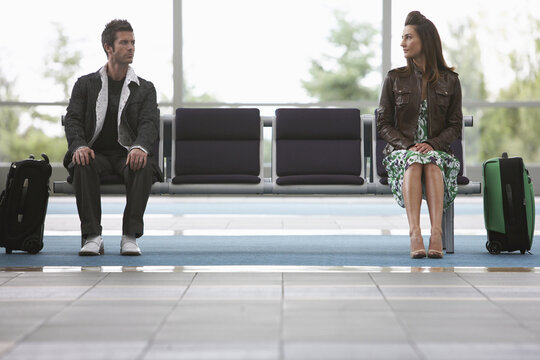 Man and Woman in Airport Waiting Area