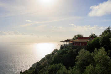 View in the evening under a blue sky over the bay and the sea at Paleokastrtitsa on the island of Corfu