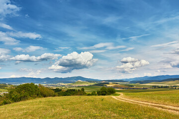 Slovakia summer landscape. Green summer fields, meadows, hills of Tatra mountains. Travel in vacations. Rural Road in Spis region, Slovakia. Spissky hrad national park - 686871459