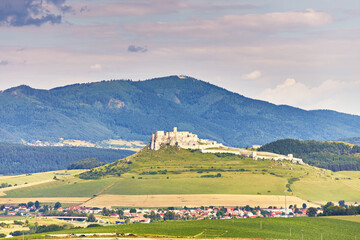 Spiss castle (spissky hrad) in summer day, medieval ruin, unesco heritage, Slovakia, Europe. Slovakia summer landscape. Green summer fields, meadows, hills of Tatra mountain. - 686871478