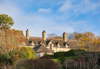 Unidentifiable period property in the countryside. Illuminated by the soft morning sunlight