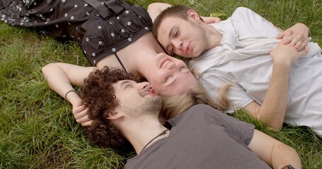 Romantic relationships among three individuals polyamory, involve consensually and openly loving and connecting with multiple partners simultaneously. Girl and two guys. 