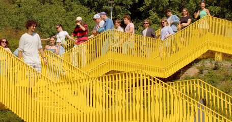 An inspired group people walk down stairs city Social Events Youth groups might use urban stairs meeting place organizing social events could include picnics celebrations simply spending time together