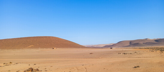 Beautiful natural view of moroccan desert landscape on sunny day with beautiful blue sky. Moroccan southern regions hills.