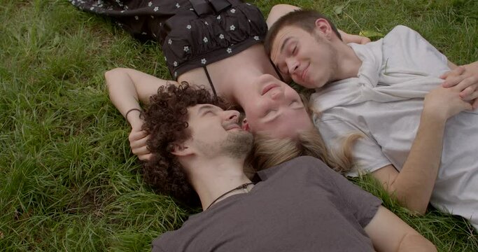 Romantic relationships among three individuals polyamory, involve consensually and openly loving and connecting with multiple partners simultaneously. Girl and two guys. 