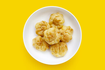 Cream puffs on white background