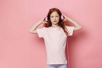 Cute small children girl little listen earphones childhood headphones happy music