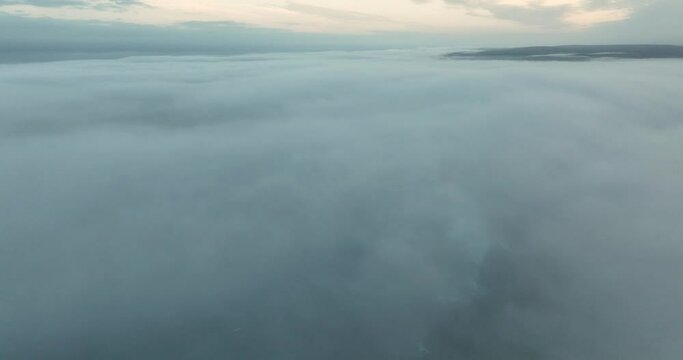 Flying over the clouds. Beautiful sunrise over the clouds 4k
