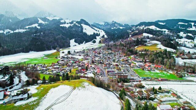 Aerial view of Swiss heritage site of national significance Gruy&egrave;res Castle. View from above of hilltop fortress covered by snow in Switzerland.