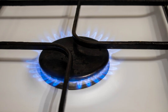 gas pipe with open yellow valve and burning gas burner, double exposure of natural gas use