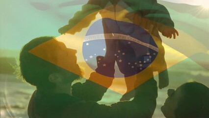 Animation of brazilian flag over happy caucasian parents and child on sunny beach - Powered by Adobe