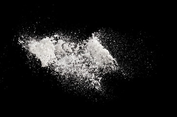 Photo image of throwing snow fly in air. Snows Freeze shot on black background isolated overlay. Fluffy White snowflakes splash cloud in falling down. Real Snow throwing shower